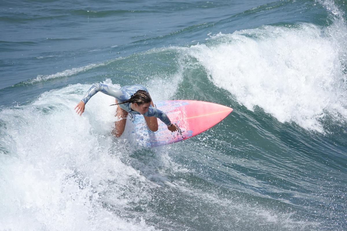 Female surfer catching the wave