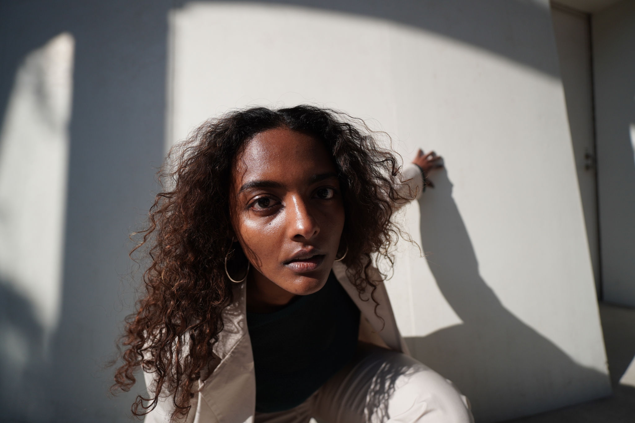 Portrait of a female model with half her face in shadow