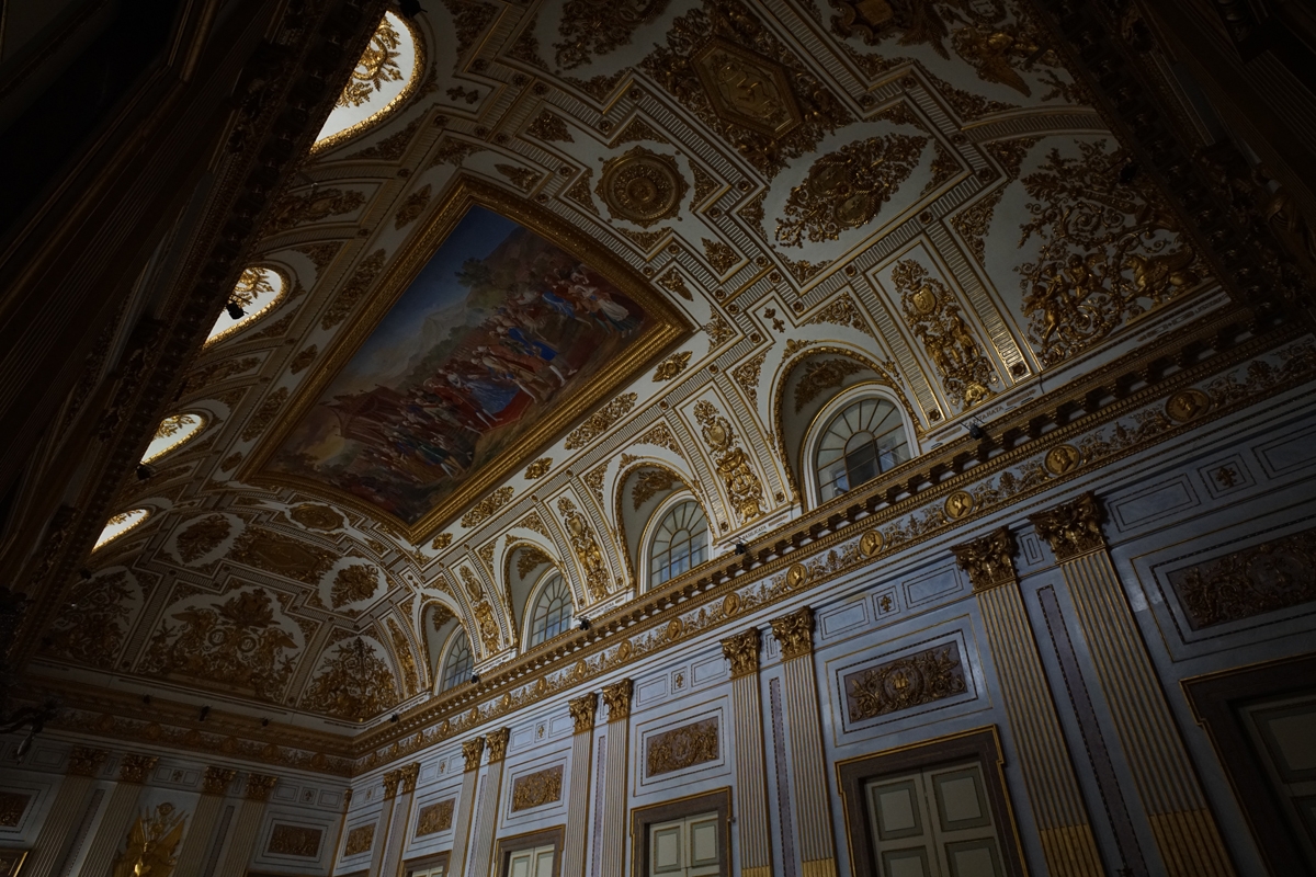 Shot of ornate interior of hall with ceiling mural and other decoration