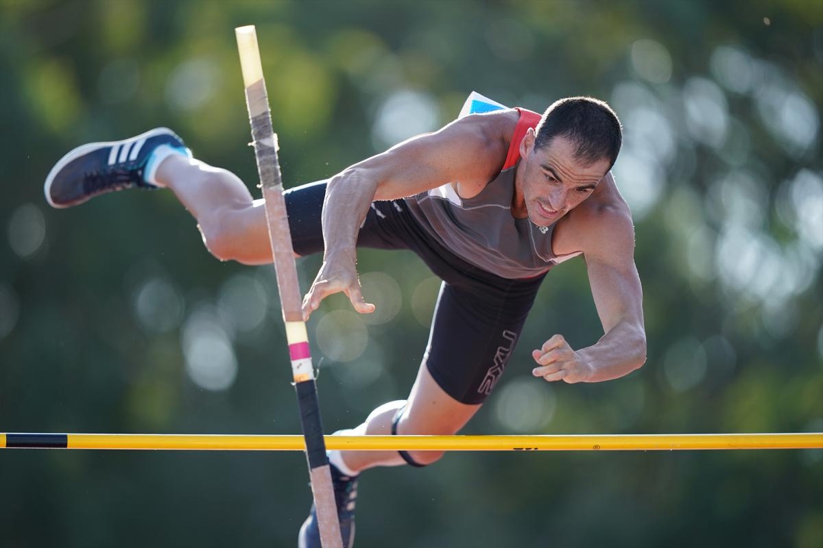Pole vaulter clearing the bar