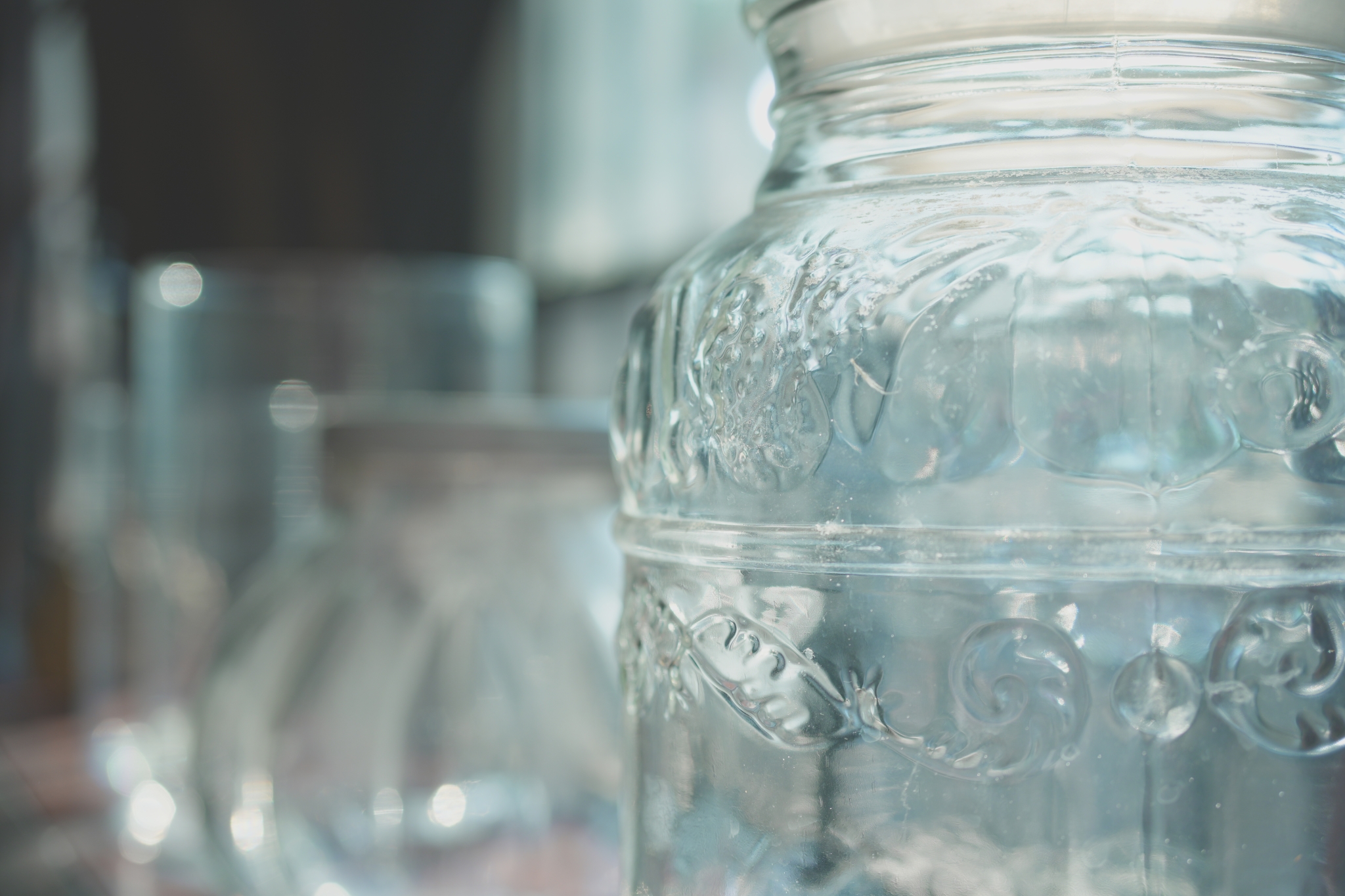 Close-up of a glass jar with jars in bokeh background