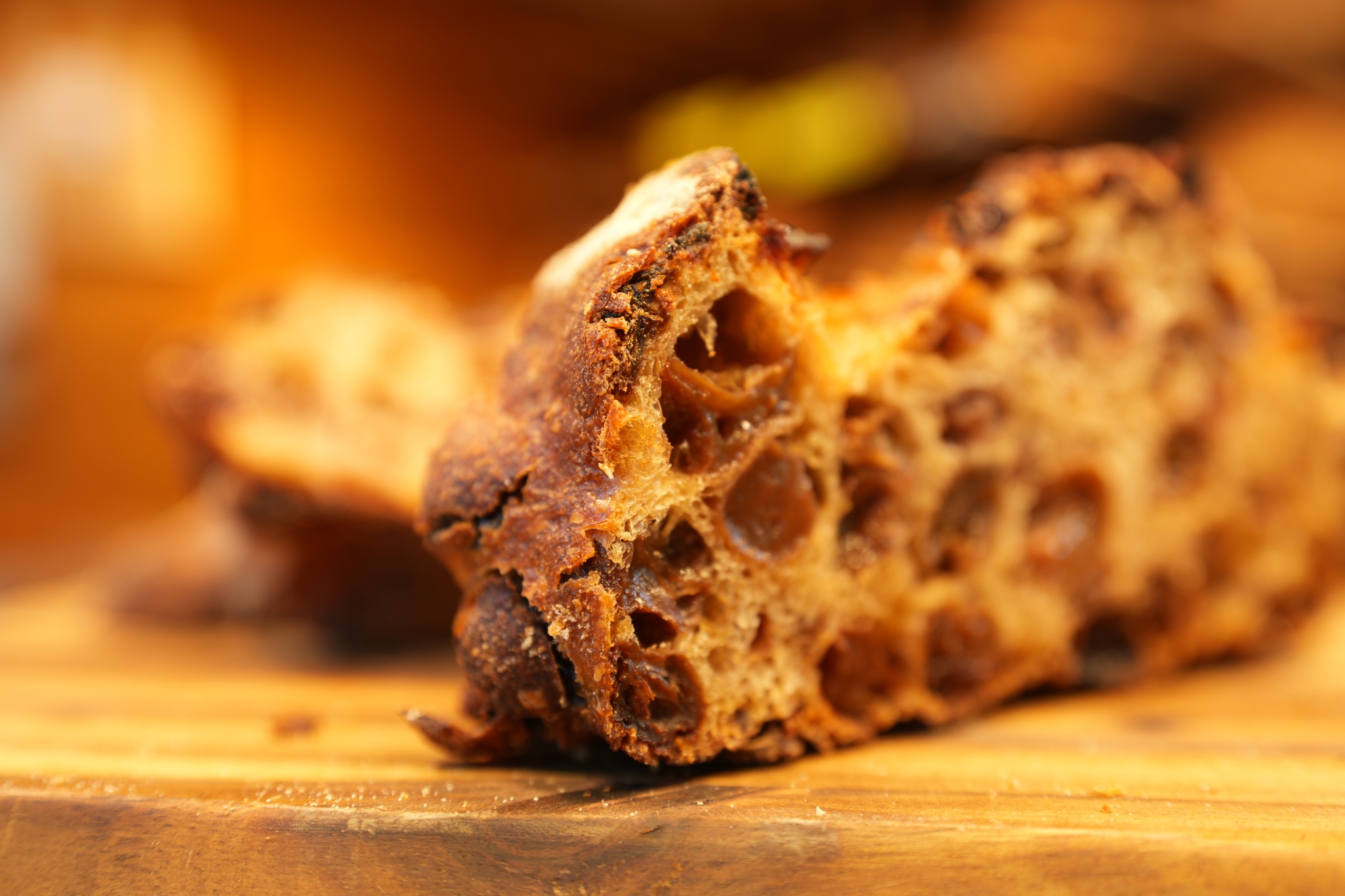 Close-up of sliced sultana bread with bokeh background
