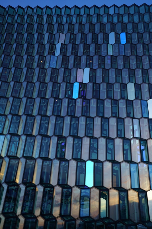 Shot of building face made of wall of prism-like windows