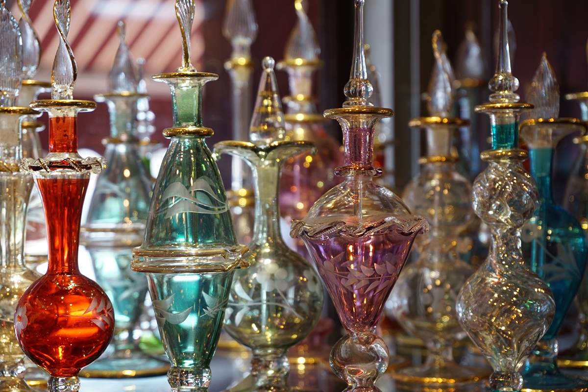 Collection of multi-coloured ornamental glass bottles