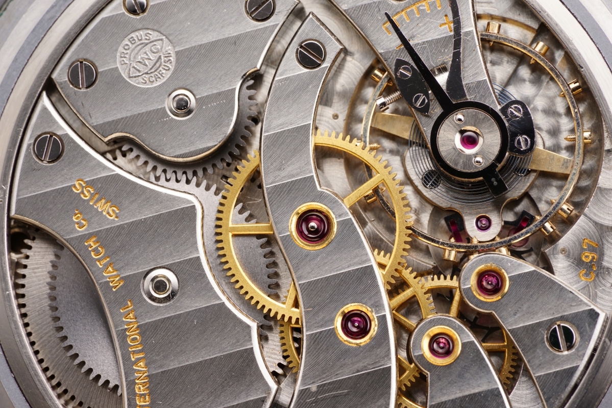 Close-up of internal parts of watch including several cogwheels