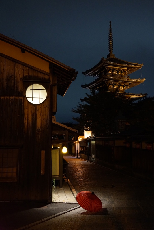Wooden buildings and temple pagoda at night