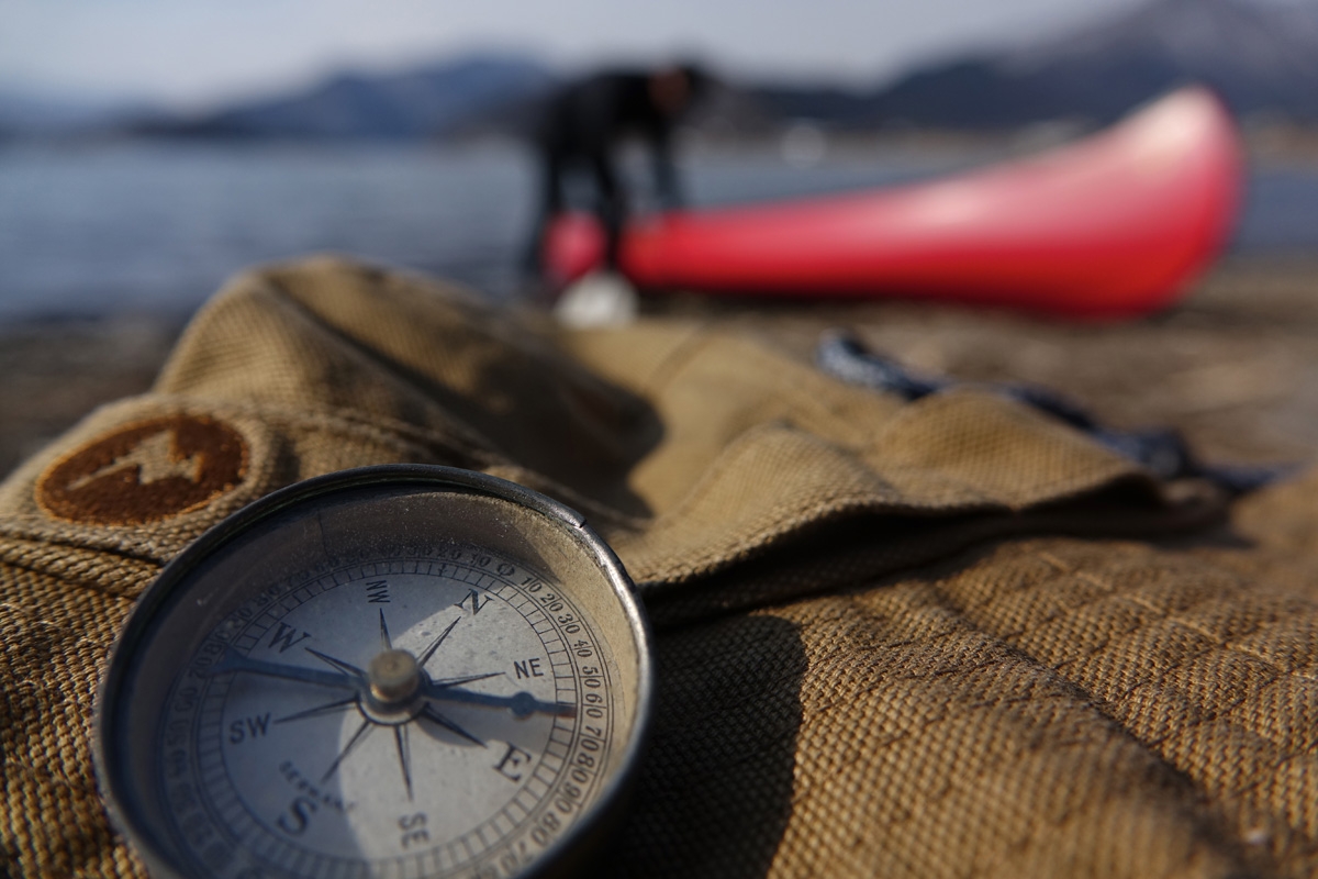 Close-up of compass on sack with deep background bokeh