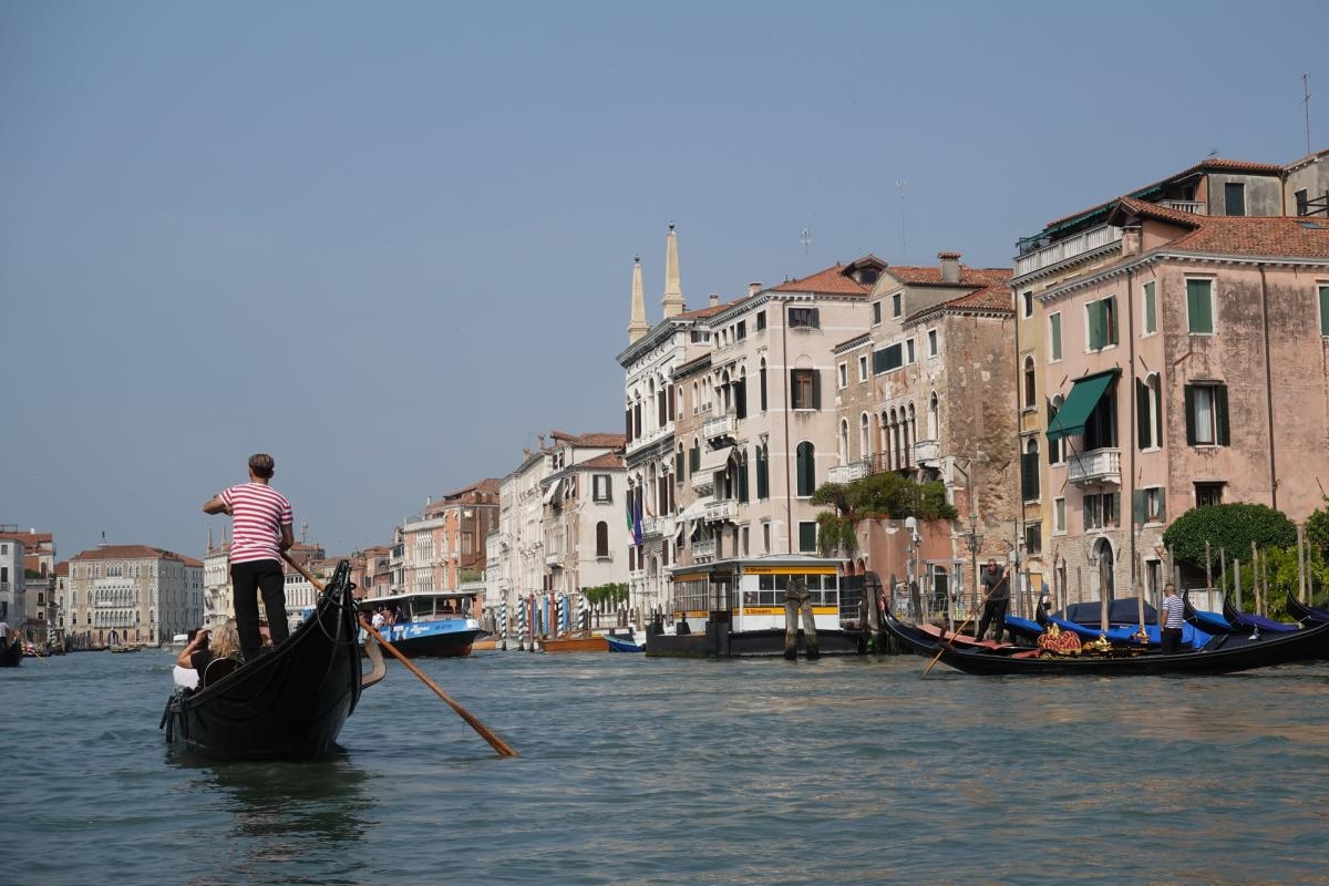 Venetian canal shot with gondola and gondolier