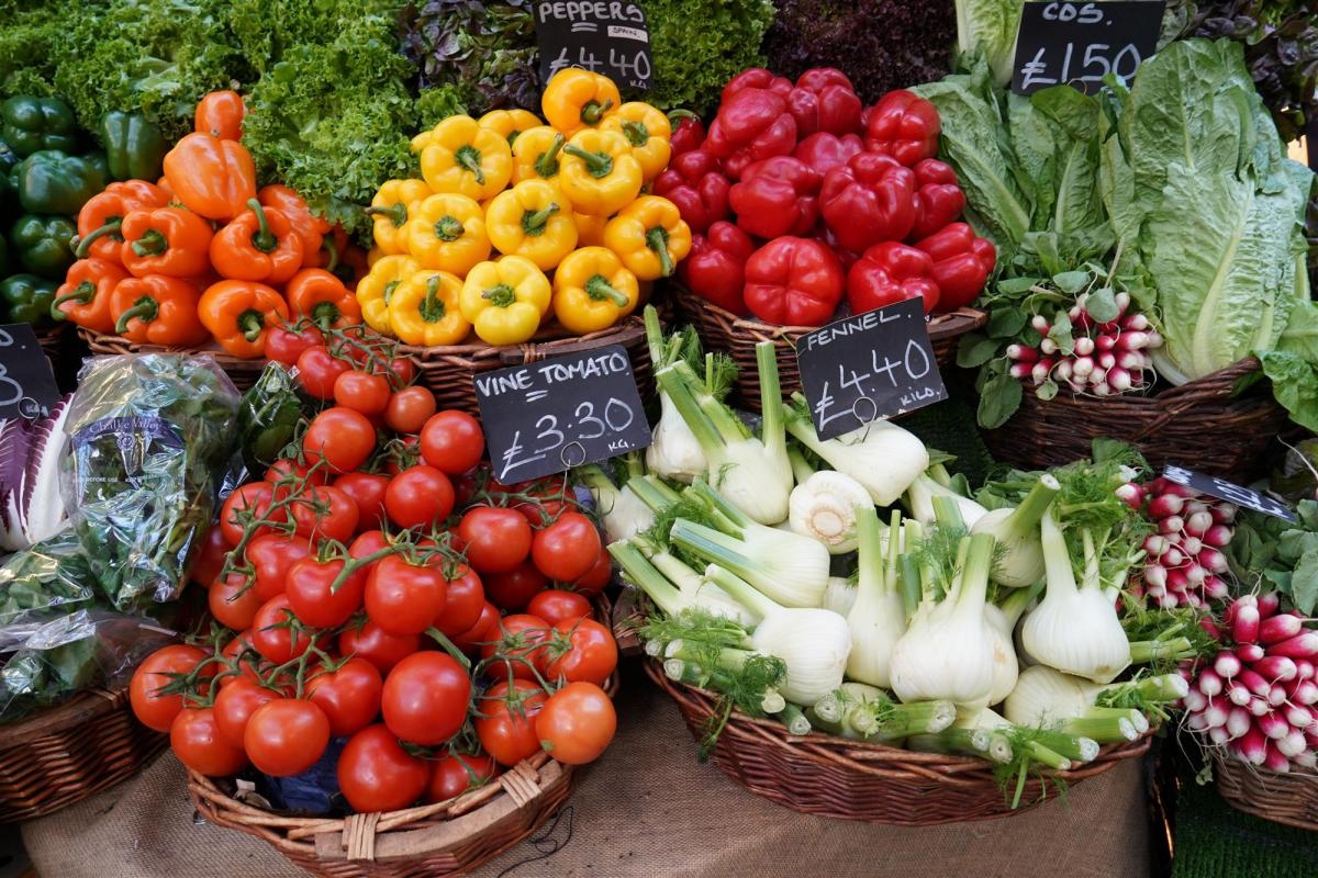 Baskets of tomatoes, bell peppers, garlic, etc.