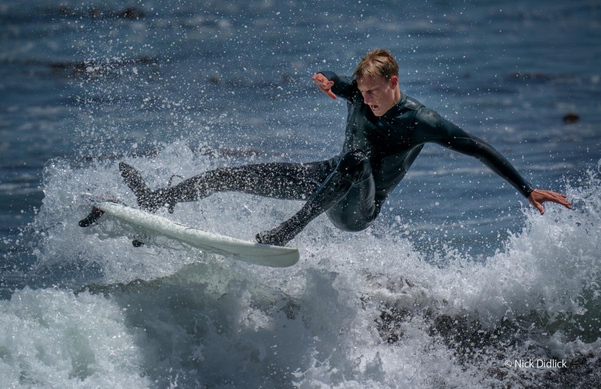 Surfer in action on wave