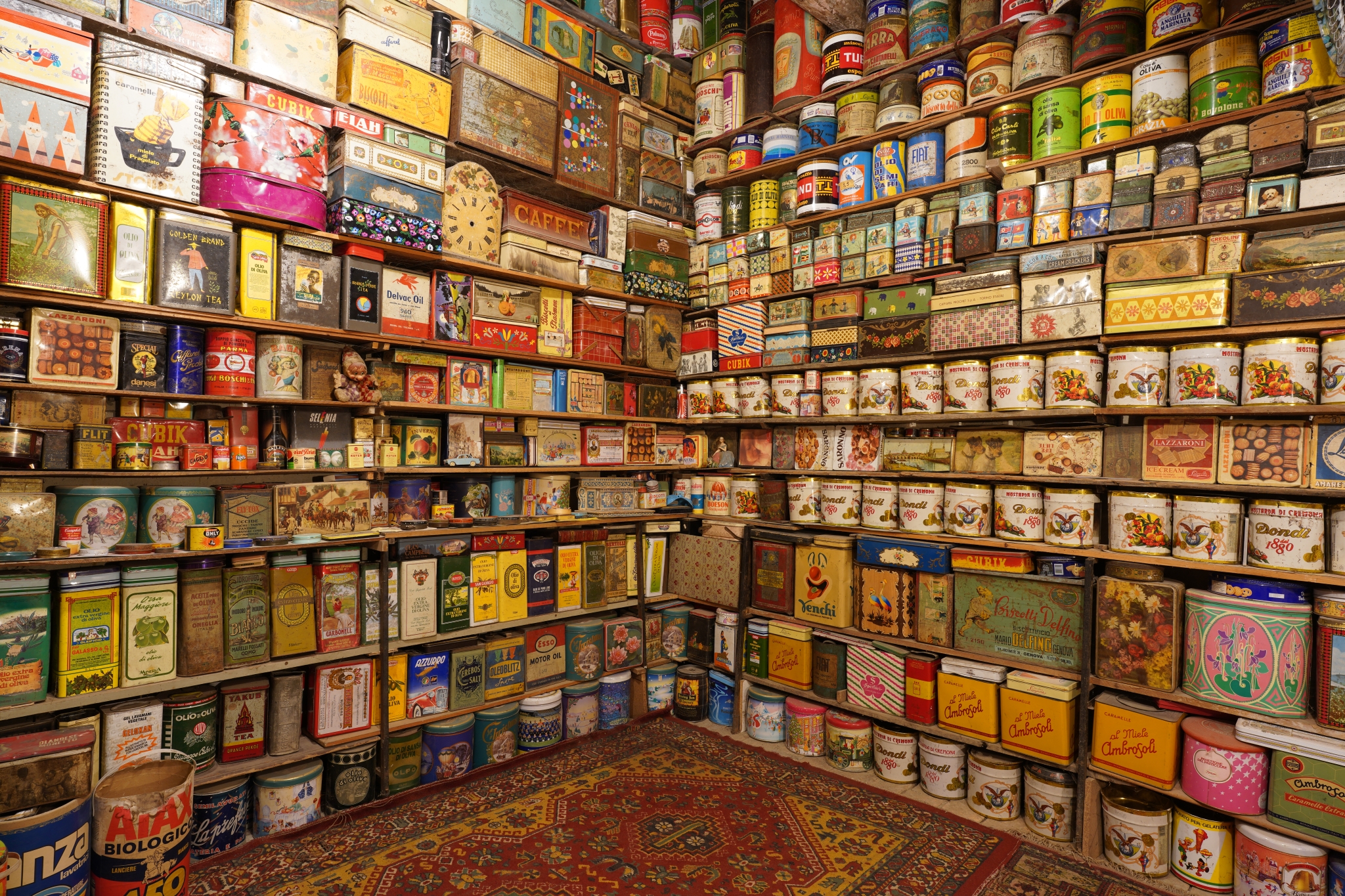 Interior of a shop with colourful tinner food stacked on shelves