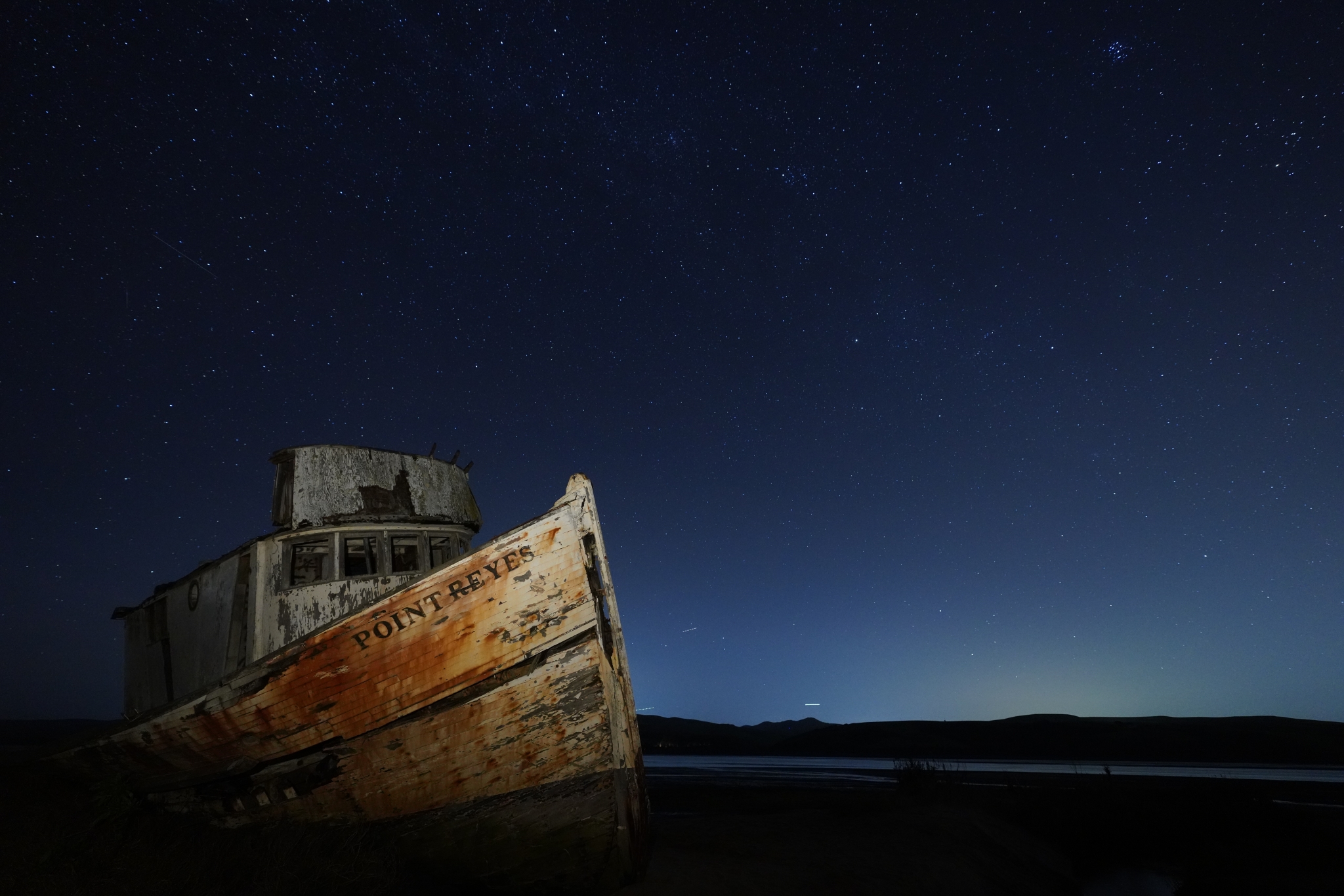 Rusty metal ship in lowlight