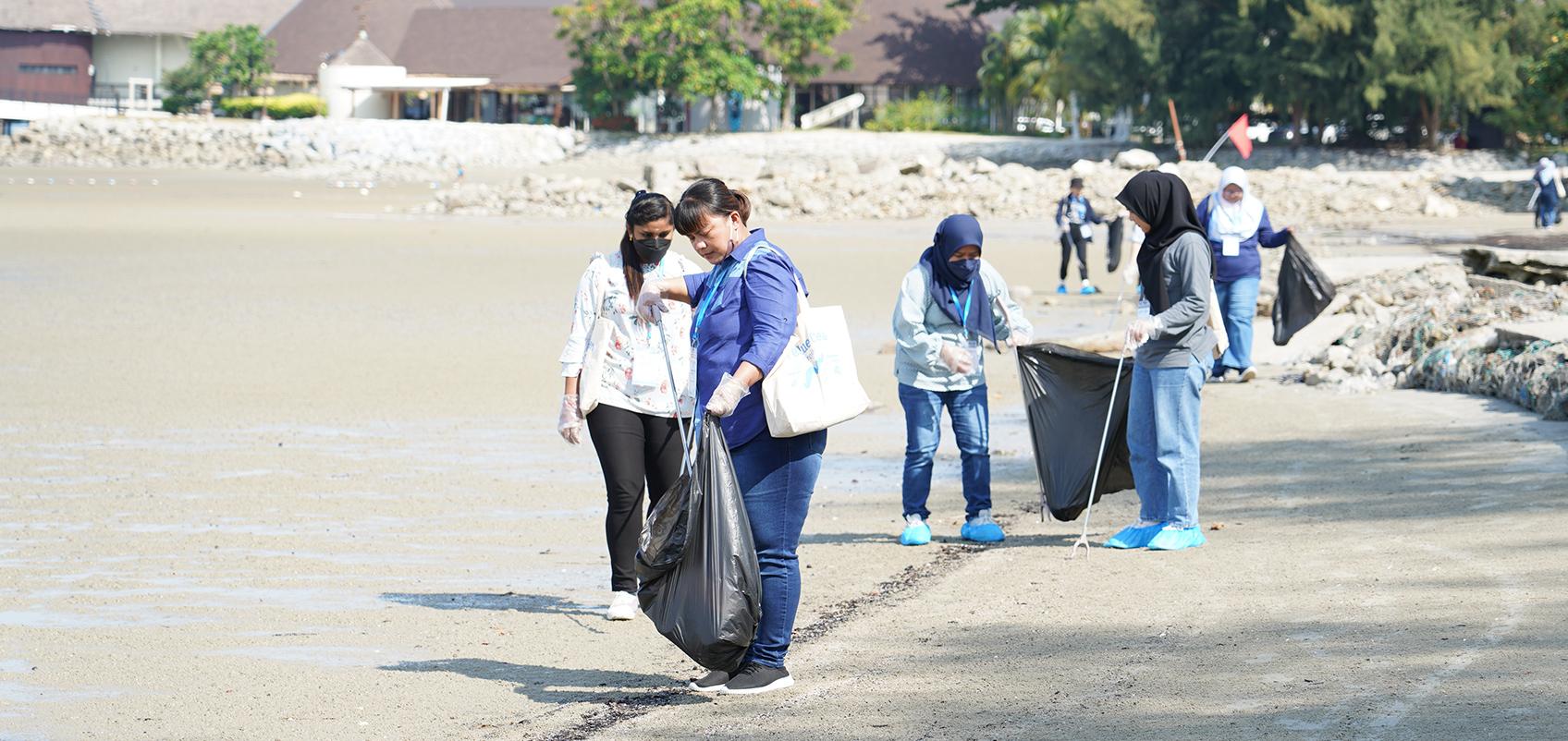Employees are cleaning up on the beach