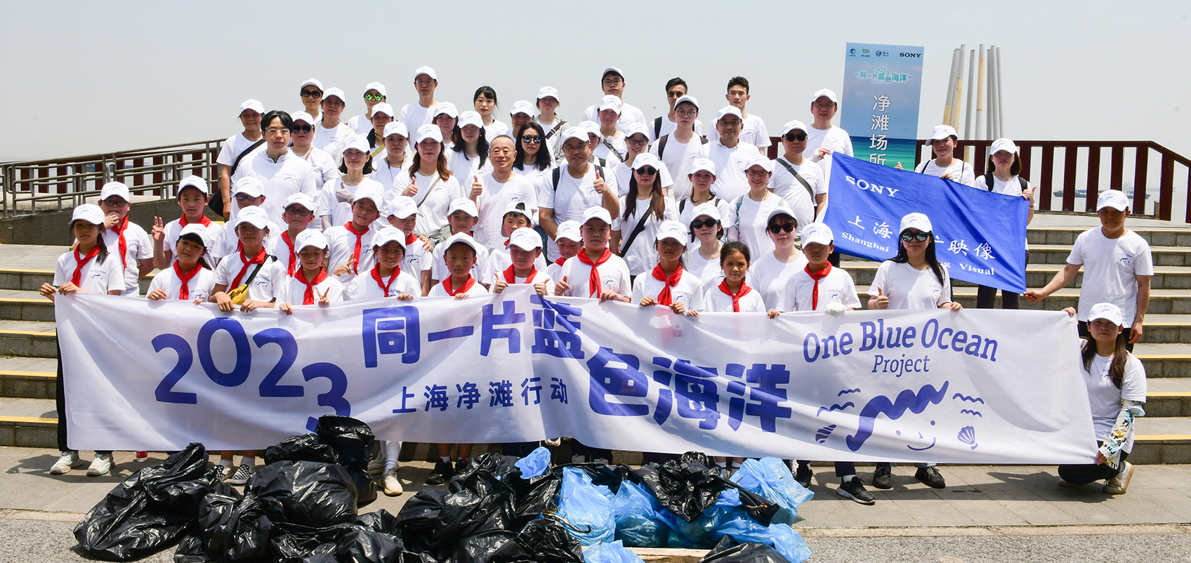 Group photo of people participating in cleanup activities